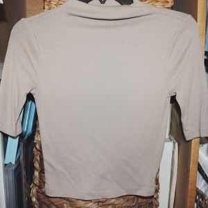Tight tan short turtle neck cropped shirt